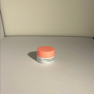 Drunk Elephant Vibrant Orange and White Moisturizer